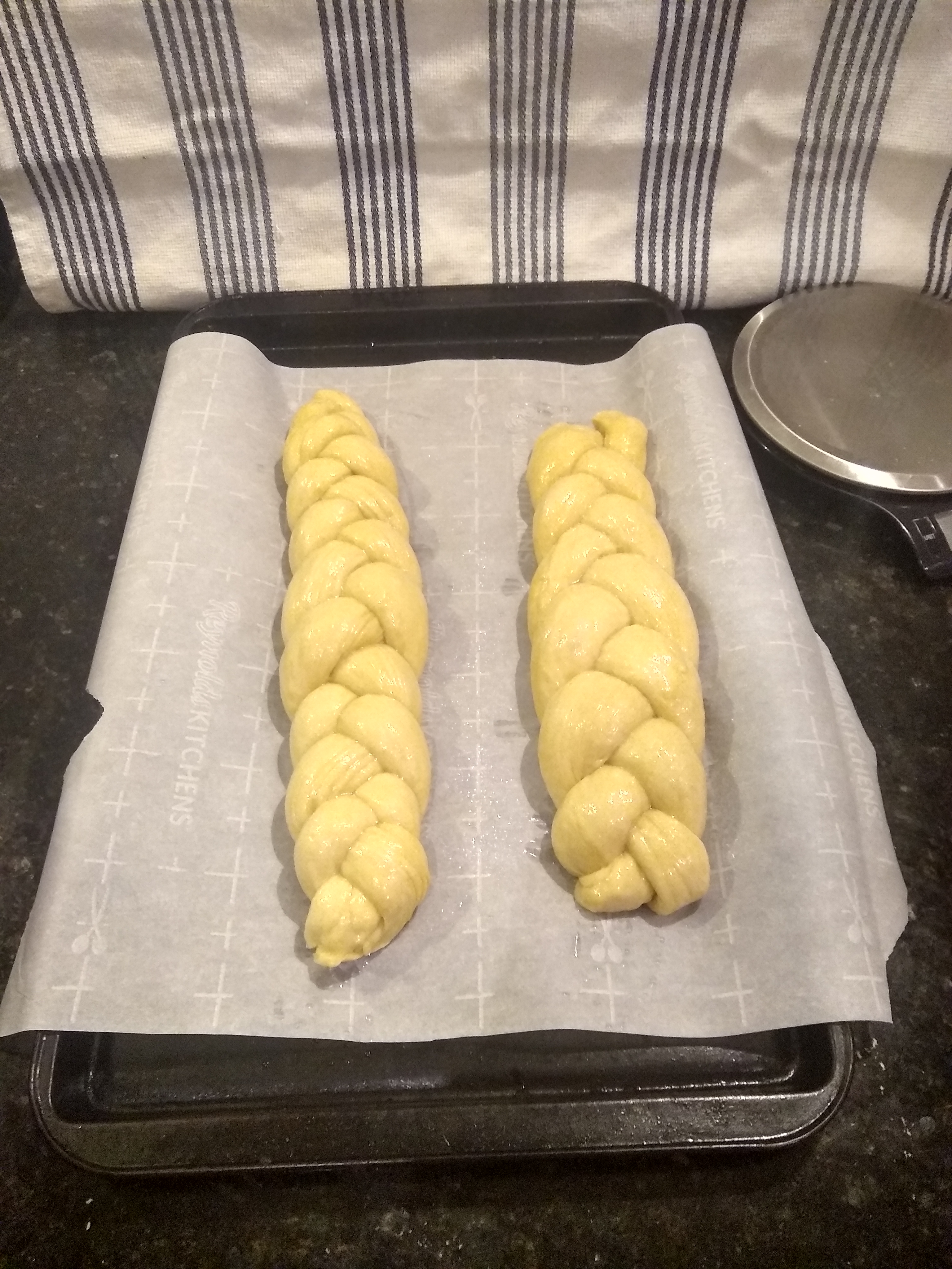 Challah loaves on a baking tray