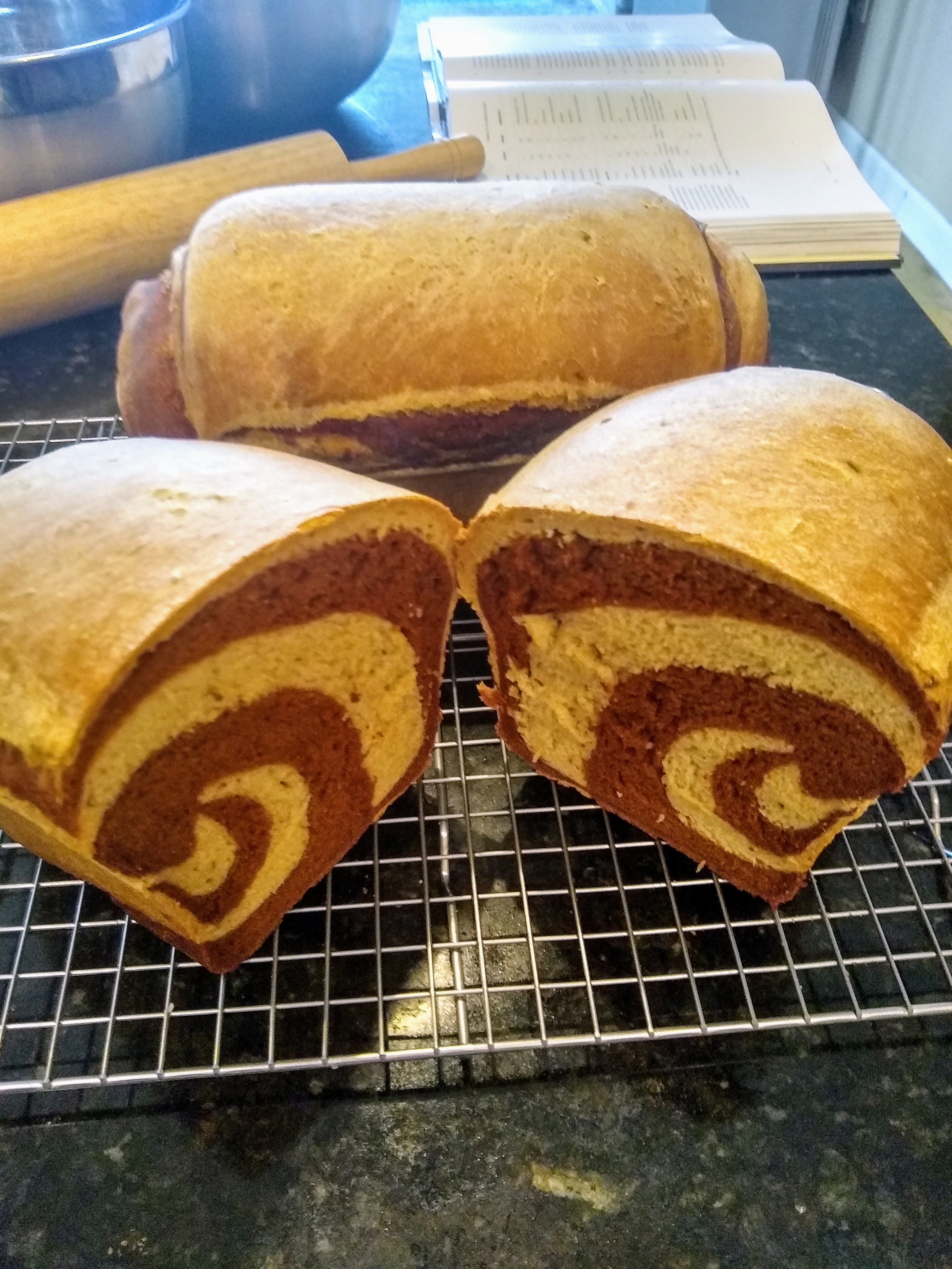Cut through a loaf of marbled rye bread