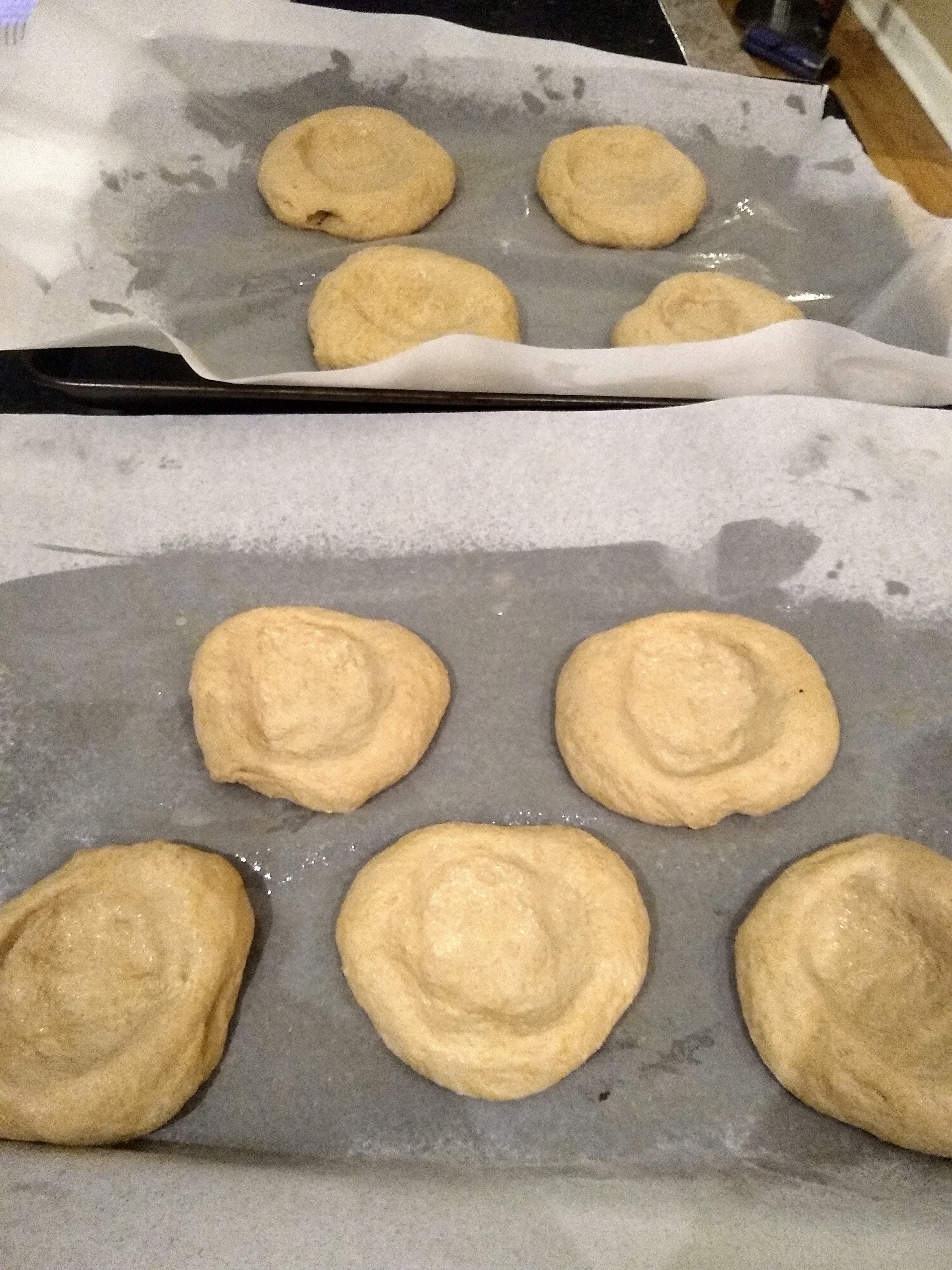 Shaped dough, flattened disks with a big indentation in the middle.