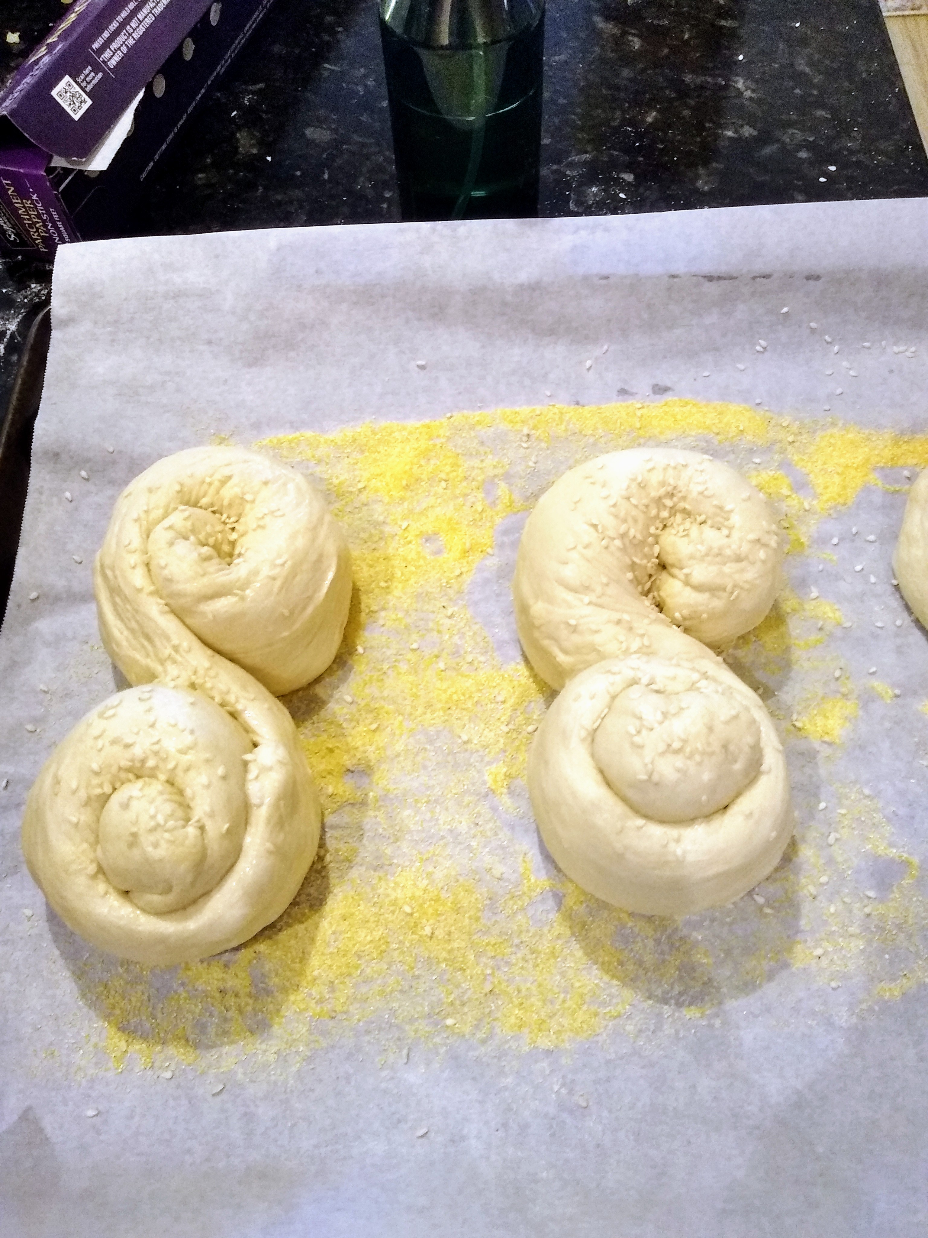 Dough shaped into two S-shaped loaves