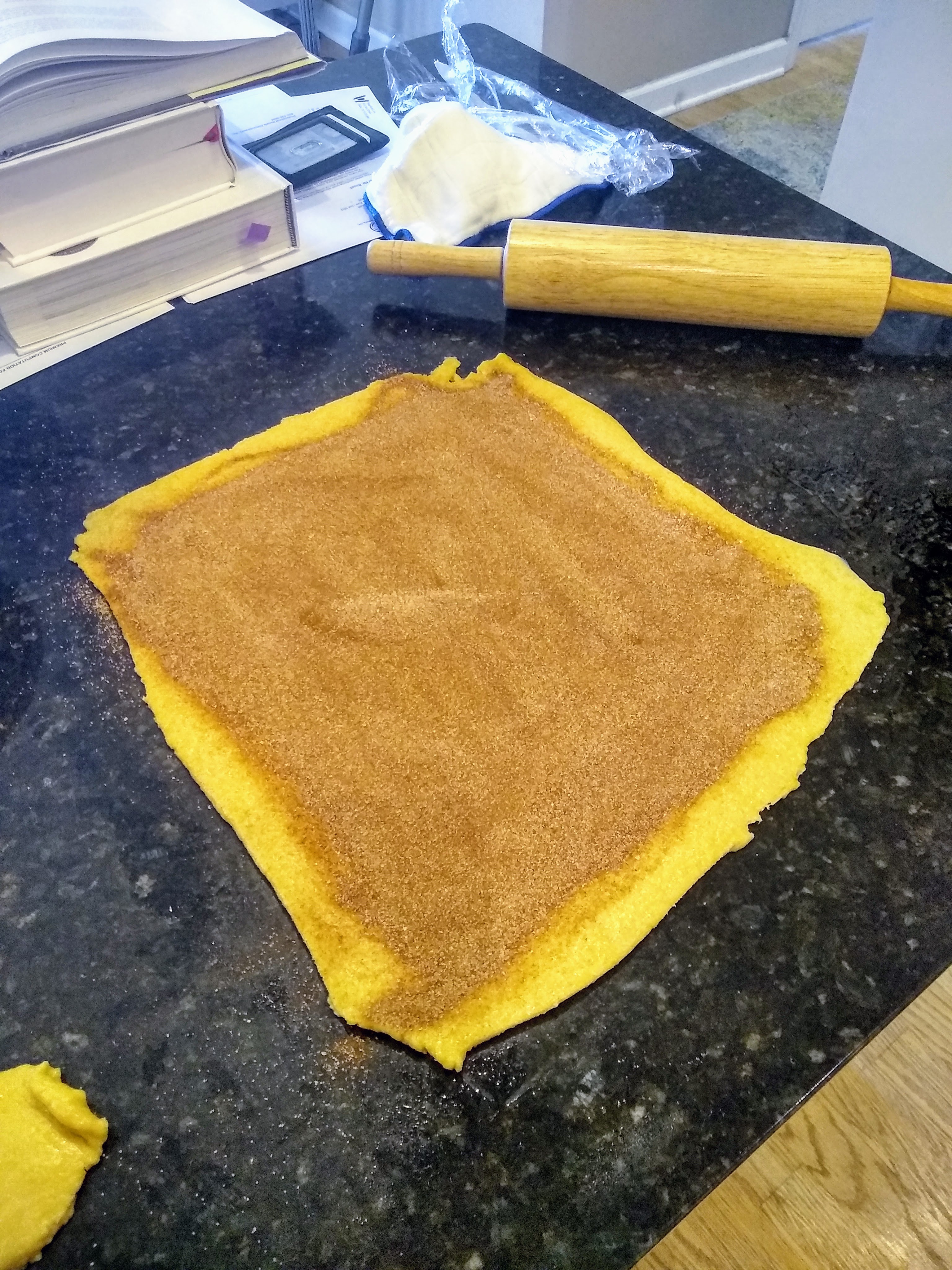 A sheet of dough, covered in cinnamon sugar.